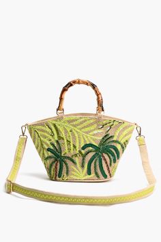 America & Beyond Palm Tree Beaded Mini Tote The Palm Tree Beaded Mini Tote is a chic and versatile accessory that combines style with functionality.This hand-held tote is designed with durability in mind, featuring bamboo-looking handles that add a touch of natural charm. The medium size makes it perfect for carrying your essentials without weighing you down, while the detachable and adjustable long straps with lace detailing offer versatility in carrying options.Adorned with exquisite embellishments, including beads in a charming palm tree design on the front, this tote adds a tropical flair to any outfit. Crafted from cotton jacquard with a hint of gold lurex, it boasts a luxurious texture and subtle shimmer that catches the light beautifully.The magnetic button closure ensures easy acce Leopard Bag, Embellished Bags, Tassel Jewelry, Small Pouches, Beach Tote Bags, Mini Tote, Bag Dress, The Palm, Pocket Size