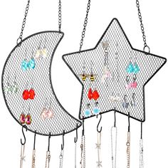 two metal stars hanging from chains with beads