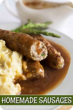 a plate with mashed potatoes, meat and gravy