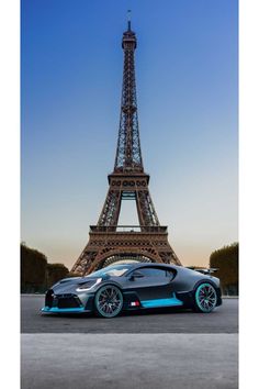 the bugatti supercar is parked in front of the eiffel tower