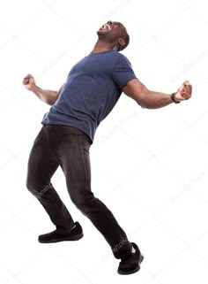 a man jumping up in the air with his arms wide open and eyes closed stock photo