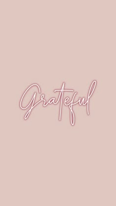 the word grateful written in cursive writing on a pink background