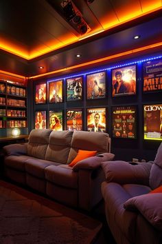 a movie theater with two recliners in front of a wall full of movies