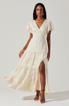 Embroidered flutter sleeve tiered maxi dress V-neckline, tie detail at back of neck Fully lined, concealed zipper at side seam Left leg slit above knee, elasticized back Self: 60% Polyester, 30% Acrylic, 10% Rayon Lining: 100% Rayon Dry clean only Style #ACDR102318 Country Chic Dress, Long Senior Picture Dress, Fall Engagement Dress, Ivory Boho Dress, Country Chic Dresses, Senior Pictures Dresses, Texture Dress, Engagement Photo Dress, Textured Maxi Dress