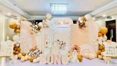 an event with balloons and decorations on the wall, along with letters that spell out congratulations