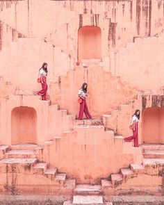 three women in red and white outfits walking up some steps with their backs to the camera