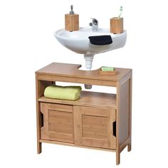 a sink and cabinet with towels on it