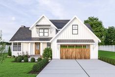 a white house with brown garage doors and windows