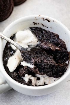 a bowl of ice cream and chocolate cookies