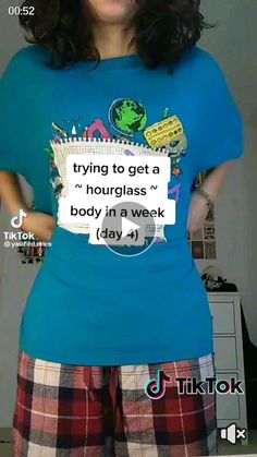 a woman in plaid pants and a blue shirt with a sign on her chest that says trying to get a hourglass body in a week