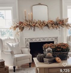 a living room filled with furniture and a fire place in front of a fireplace covered in candles