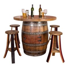 a wooden barrel table with stools around it