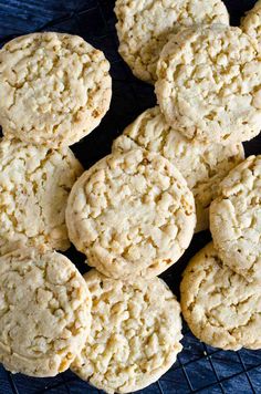 a bunch of cookies sitting on top of a cooling rack