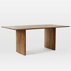 a wooden table sitting on top of a white floor