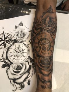 a person with a tattoo on their arm next to a clock and rose flower design