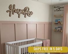 a baby's room with pink walls and white crib