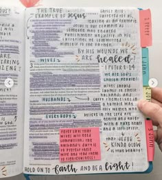 someone is holding an open bible in their hand with the words on it and two sticky notes