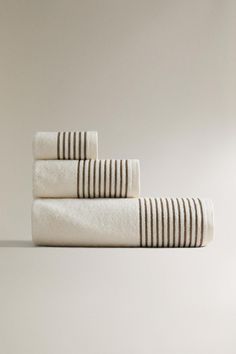 three white towels stacked on top of each other