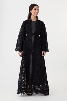 Crafted from luxurious Guipure lace, this black open abaya features raw lace edges along the placket, cuffs, and hemline, adding a touch of sophistication. Perfect for elegant evenings or special occasions.DETAILS: Fabric: Guipure Lace (100% polyester) — a luxurious lace often used for bridal dresses No front buttons Style with an open front Includes a belt Model's height: 5'4 / 163cm Model is UK6 and wears size XS-S MEASUREMENTS: XS-S Length: 143 cm / 56 inches Bust: 100cm / 39 inches Hips: 120 Guipure Lace, Belt Shop, Lace Edging, Front Open, Wedding Events