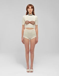 Materials: Knit cottonColors: BeigeDescription: Three-piece knitted set featuring high-waisted micro shorts and removable upper braDetailsShirt: Removable upper bra High neckline Short set-in sleeves Knitted top Cut out bra cups Shorts: High-waisted micro shorts Elastic waistband Knitted shorts Model wearing: SMADE IN ALBANIA BUST WAIST HIPS (cm)XS 84 64 94S 88 68 98M 94 72 102L 102 78 106XL 108 84 110CUSTOM SIZE: We can make any design custom based on your measurements. Customization is offered also about color and some design. Feel free to write us a message. Knitted Shorts, Micro Shorts, Short Models, Knitted Top, Knit Shorts, Short Set, Engineered Garments, Knit Set, Bra Cups