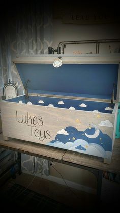 a wooden box with writing on it that says luke's toys in the sky