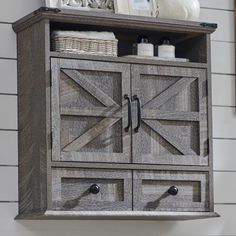 a wooden cabinet with two doors and drawers