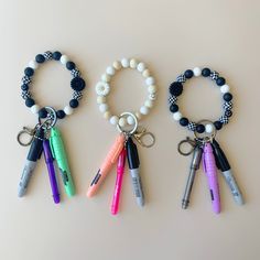 Nurse Badge Reel Keychain for Med Student Gift Idea for Nurse Student Graduation Gift Medical Job Accessory Gift Custom Nurse Wristlet Gift 𝙃𝙊𝙒 𝙏𝙊 𝙊𝙍𝘿𝙀𝙍: 1. Select Wristlet Color 2. Select Set Option 3. In personalization box input:  your colors preferences (if any) for the highlighter and pen 4. Add to cart 𝙇𝙄𝙎𝙏𝙄𝙉𝙂 𝙄𝙉𝘾𝙇𝙐𝘿𝙀𝙎: 🎀 A wristlet with your choice of color (black or beige) 🎀 The full set comes with: - Mini Permanent marker - Mini Highlighter - Mini Pen (black i Nursing Lanyard, Adjustable Badge Reel With Key Clip As Gift, Nursing Student Badge Reel, Medical Keychain, Nursing Keychain, Med Student Gift, Medical Jobs, Gifts For Nurses, Nurse Student