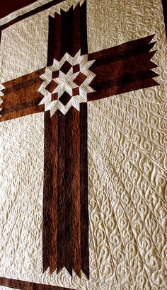 a quilt made to look like a cross