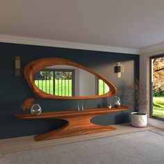 a large mirror sitting on top of a wooden shelf in a living room next to a window