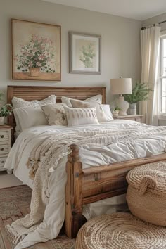 a bed with white linens and pillows in a bedroom next to a large window