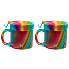 two colorful coffee mugs sitting next to each other