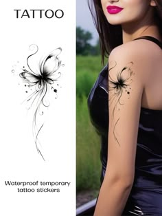 a woman with tattoos on her arm and shoulder is standing next to a sign that says waterproof temporary tattoo stickers