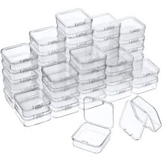 plastic food storage containers with lids and dividers are stacked on top of each other