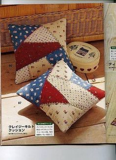 a magazine with two pillows and a basket on the floor next to it, in japanese