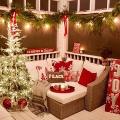 a decorated porch with christmas decorations and lights