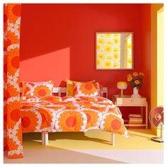 an orange and white bedroom with red walls