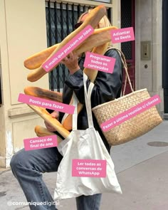 a man sitting on the sidewalk with lots of bread in his hands and words written all over him