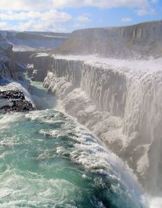 the water is crystal blue and green in this photo, as if it were frozen