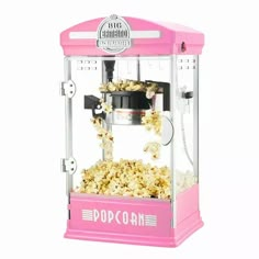 a pink popcorn machine is shown with measurements