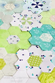 the hexagons are laid out on top of each other to be quilted