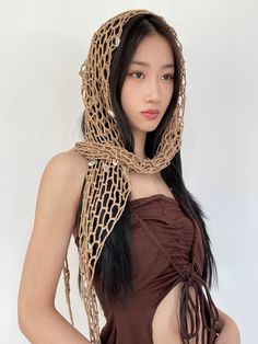 Unveil the essence of bohemian charm with our Crocheted Mesh Shawl Wrap, a versatile accessory that seamlessly marries form and function. Crafted with intricate crocheted mesh, this wrap exudes a handcrafted appeal, giving it an organic texture that is both appealing to the touch and a delight to the eye. Its triangular cloak shape ensures it drapes effortlessly over any outfit, elevating your look with a touch of boho style. The multifunctional design enables you to style it as a shawl, wrap sk Crochet Mesh Headband, Avant Garde Crochet Fashion, Crochet Mesh Shawl, Crochet With Chain, Mesh Vest Outfit, Crochet Pashmina, Crochet Rave Outfit, Crochet Mesh Hat, Headscarf Outfit