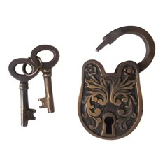 two antique style keys are next to an ornate lock and keychain on a white background