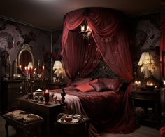 a bedroom decorated in red and gold with candles on the side tables, an ornate canopy bed