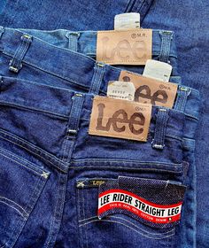 Deadstock early 1980s Lee jeans, perfect in every way! One pair even have the Lee small rag on both pockets!! A collectors dream, factory mistake and new with tags!! S p e c i f i c s . . . Label: Lee Rider Straight Leg Tagged Size: 25x32 or 25x30 Approx Fit: XS  Color: Blues // Light Brown Material: Raw Denim // Leather Lee Patch // Zipper // Logo Button  Condition: Overall in Amazing New with Tags Vintage Condition Luxury Vintage Denim Jeans, Luxury Retro Selvedge Jeans, Luxury Vintage Denim Pants, Vintage Lee Jeans, Clothing Labels Design, Vintage Faded Pre-washed Jeans, Lee Denim, Khaki Pants Men, American Jeans