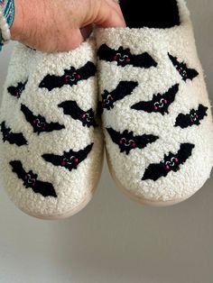 Get Spooky with Our Plush Halloween Bat Slippers! 🦇 Celebrate the spooky season in style with our adorable Halloween Bat Slippers! These slippers are perfect for all your Halloween festivities, and I’m absolutely batty for them! 🦇🤣 With their cute design and comfy fit, they’re the ultimate cozy accessory for any Halloween lover. Cozy and Comfy DesignThe Halloween Bat Slippers feature a soft fleece upper (100% polyester) and a flexible black TPR sole, known for its shock absorption. This makes Bat Slippers, Halloween Slippers, Cute Bats, Slippers Cute, Cowgirl Dresses, Halloween Festivities, Cozy Accessories, Cute Bat, Jumpsuit Men