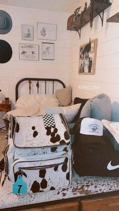 a bed room with a bunch of bags on the floor