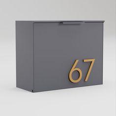 a gray box with gold numbers on the front and bottom that reads'76 '