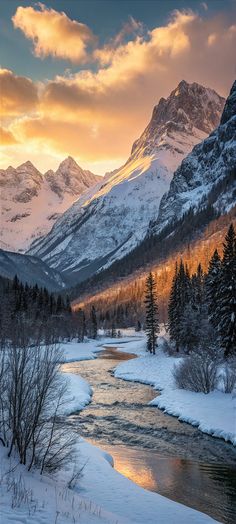 a river running through a snow covered forest next to a mountain range in the distance