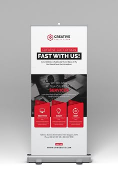 a white and red roll up banner with the words, fast with us on it