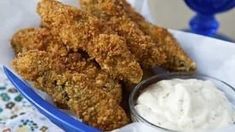 fried chicken sticks with ranch dip in a blue bowl